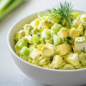 The fusion of creamy avocado with protein-rich eggs creates a delicious and nutritious dish known as Avocado-Packed Egg Salad Bliss. This recipe not only reinvents a classic favorite but also offers a healthy twist that is perfect for a light lunch or a refreshing snack. With the addition of vibrant green onions and crisp celery, this dish is both savory and satisfying. Each bite showcases a delightful blend of textures and flavors that is sure to please anyone looking for a nutritious meal option. This egg salad is light yet filling, making it perfect for warm-weather gatherings, picnics, or a simple family lunch.