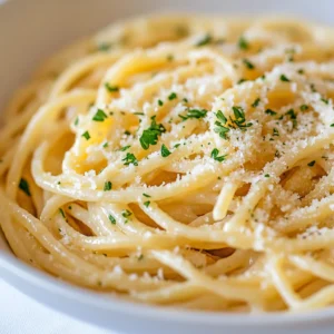 Garlic Parmesan Pasta Delight is a simple yet incredibly flavorful dish that epitomizes the comfort of home cooking. This recipe allows the rich and buttery essence of garlic to intermingle seamlessly with the nutty aroma of Parmesan cheese, creating a harmonious blend that coats each strand of pasta. The optional red pepper flakes add a lovely hint of heat, making it perfect for those who enjoy a bit of spice. Whether you're preparing a quick weeknight meal or hosting a casual dinner party, this pasta dish caters to all occasions.