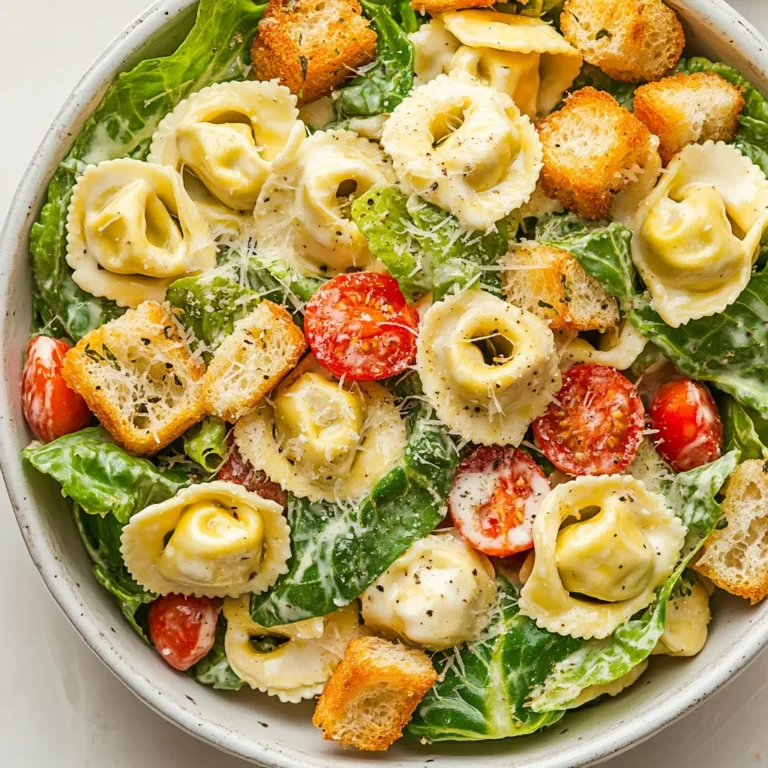 The Cheese Tortellini Caesar Pasta Salad is a delicious and easy-to-make dish, perfect for a quick lunch or dinner. The combination of cheese tortellini, romaine lettuce, cherry tomatoes, and Caesar dressing creates a flavorful and satisfying meal. This salad is ideal for those looking for a light yet filling meal option that can be prepared in no time. Not specified in the recipe is the specific taste or serving occasion, but based on its ingredients, it seems suitable for a variety of occasions, from casual gatherings to everyday meals.