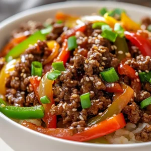 Mongolian Ground Beef Blaze is a dish that combines the bold flavors of Asia with the spicy kick of red pepper flakes, creating a culinary experience that ignites the taste buds. This recipe is perfect for those who enjoy a mix of savory and spicy flavors, making it an excellent choice for a weeknight dinner or a weekend meal. The combination of ground beef, mixed bell peppers, and a blend of sauces including soy sauce, oyster sauce, and sesame oil, creates a rich and complex flavor profile. Not specified in the recipe is the specific occasion or holiday it is typically served during, but its versatility makes it suitable for various occasions.