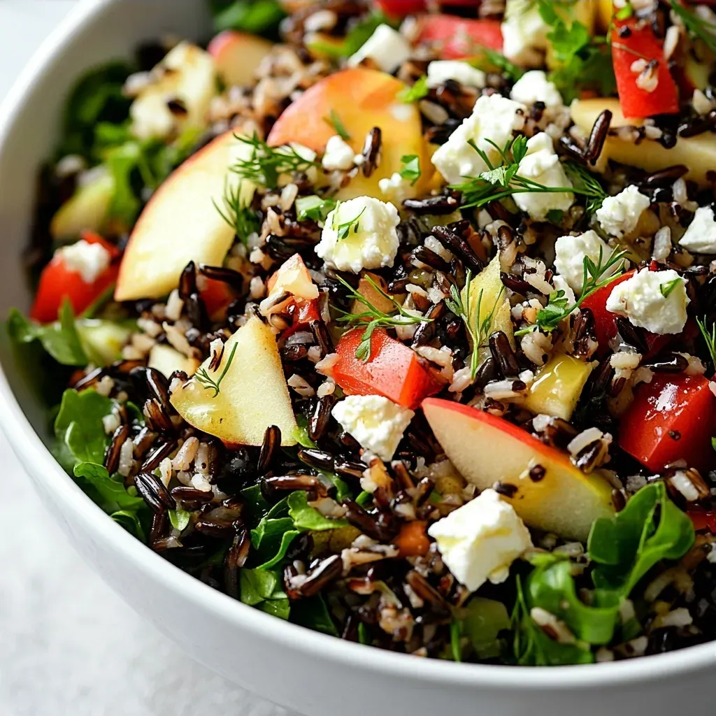 This recipe is a celebration of flavors and textures, bringing together the unique taste of wild rice with a variety of colorful vegetables and a tangy dressing. The combination of ingredients creates a refreshing salad perfect for any occasion. The use of apple cider vinegar, Dijon mustard, and herbs adds a delicious and complex flavor profile. Understanding the inspiration behind this dish is crucial to appreciating its simplicity and elegance. The Wild Rice Harvest Delight Recipe is ideal for serving at gatherings, picnics, or as a healthy lunch option, although the specific occasions when it is best served are not specified in the recipe. The taste of this salad is a perfect blend of tangy, sweet, and savory flavors, with the wild rice providing a nutty and earthy undertone. When to serve this dish is also not specified in the recipe, but its versatility makes it suitable for various events and meals.